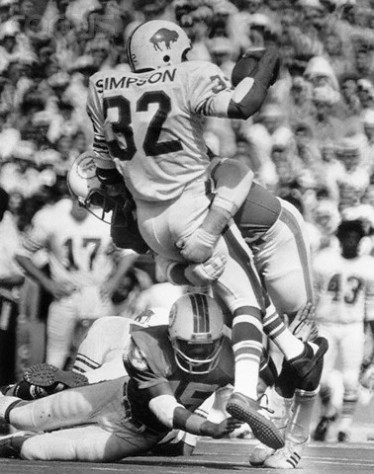 O.J. Simpson Tackled by Dolphin's Defense