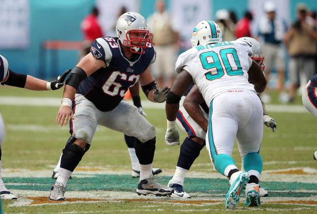 New England Patriots guard Dan Connolly (63) blocks Miami Dolphins nose tackle Earl Mitchell (90) during the NFL week 1 regular season football game against the Miami Dolphins on Sunday, Sept. 7, 2014 in Miami Gardens, Fla. The Dolphins won the game 33-20. (AP Photo/Paul Spinelli)