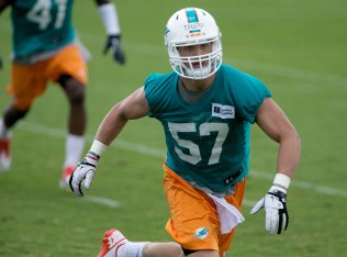 Miami Dolphins rookie linebacker Jordan Tripp (57) at Dolphins training camp in Davie, Florida on May 27, 2014. (Allen Eyestone / The Palm Beach Post)